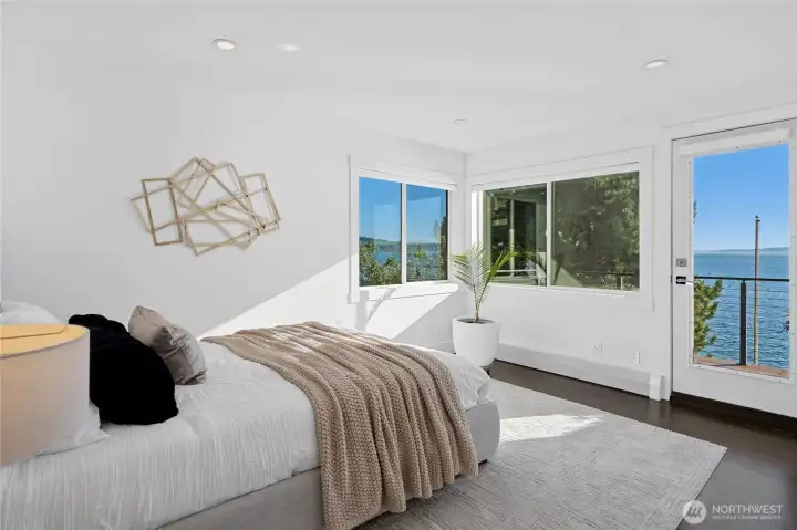 The second bedroom on the upper level has it's own deck with incredible views of the water and mountains