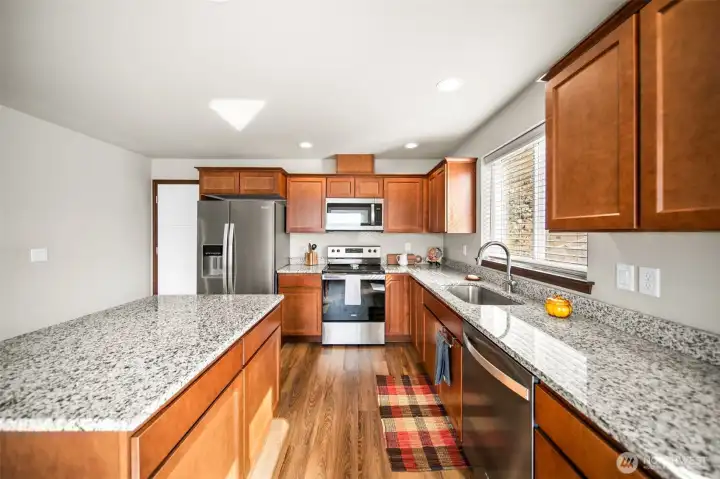 Granite counter tops and plenty of storage.
