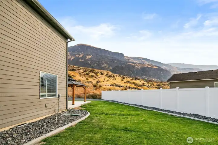 Backyard with curbing and sprinkler system.