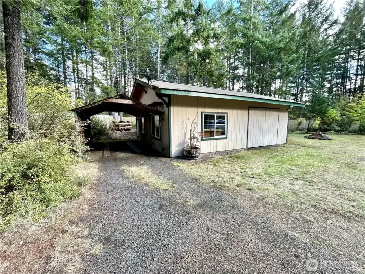 Shop with ample attached carport.