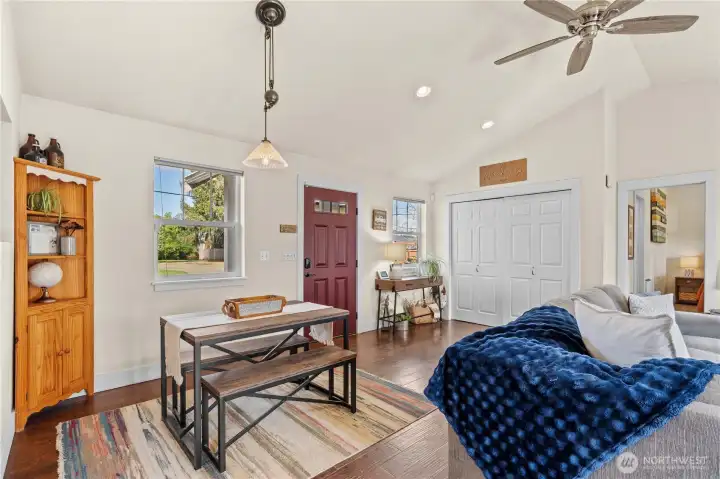 Step into an inviting open living space with vaulted ceilings and a warm, cozy atmosphere.