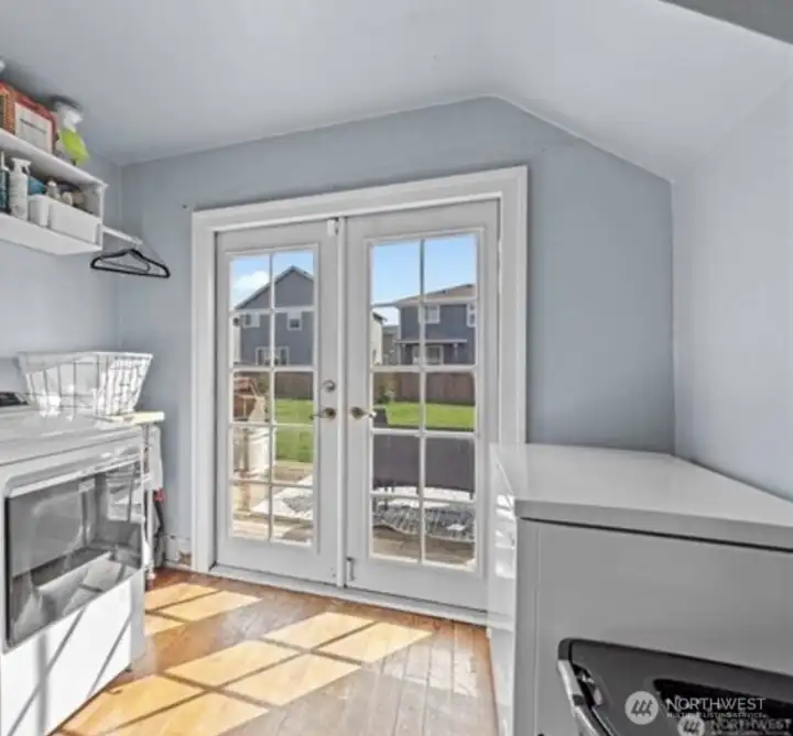 Laundry/mudroom with French doors.