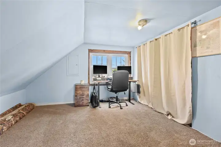 Upstairs you’ll find two additional rooms, providing flexible space for bedrooms, an office, or extra living area.