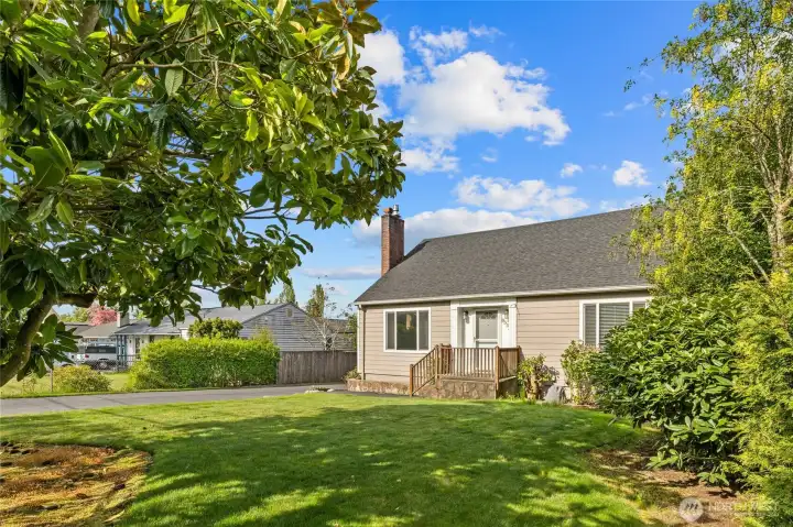 Beautifully maintained mature landscaping, new siding and new windows. Perfect little front porch area.