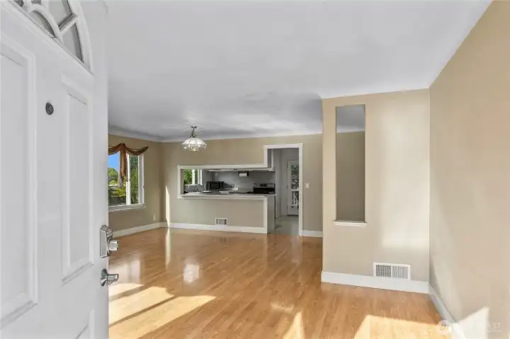 Front entry showing new laminate flooring and open living concept.