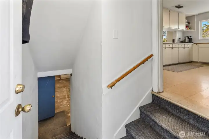 Entry to basement accessed from off the kitchen and the back deck area.
