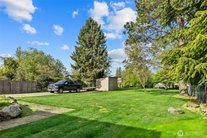 View from back deck landing into your massive 1/2 acre lot! Tons of parking here for your RV Boat or extra vehicles.