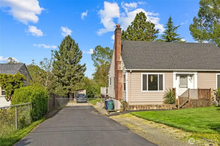 TONS of parking two car wide driveway asphalted then behind the gate gravel area for more parking or easy access already in for your back yard expansion plans.