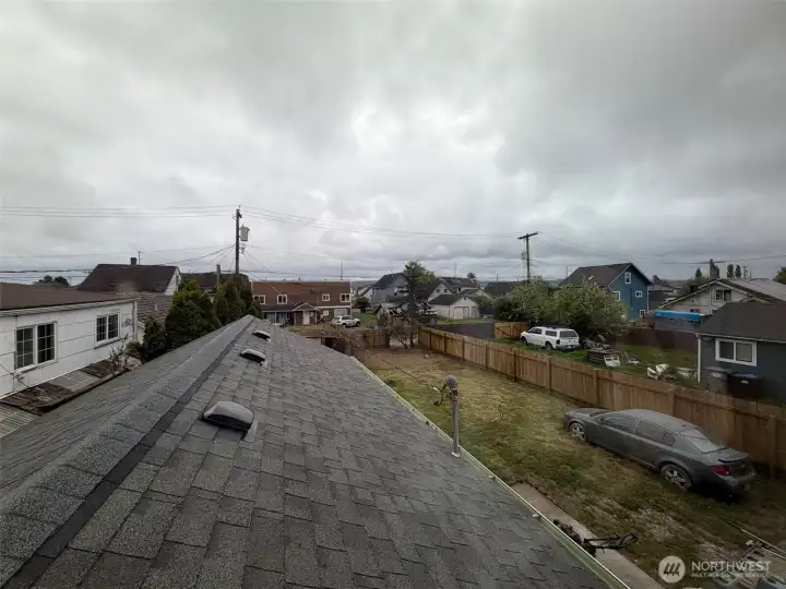 View from bonus space overlooking roof of primary bedroom