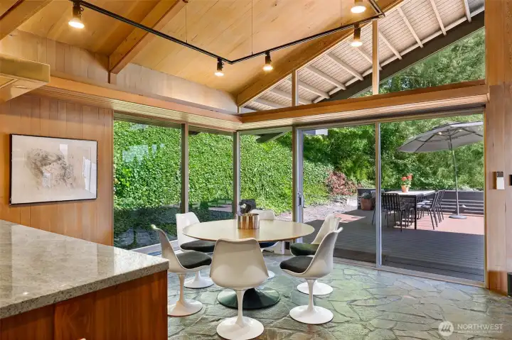 Kitchen/ dining area spills out to the enormous southwest facing deck. Kitchen/ dining area spills out to the enormous southwest facing deck.
