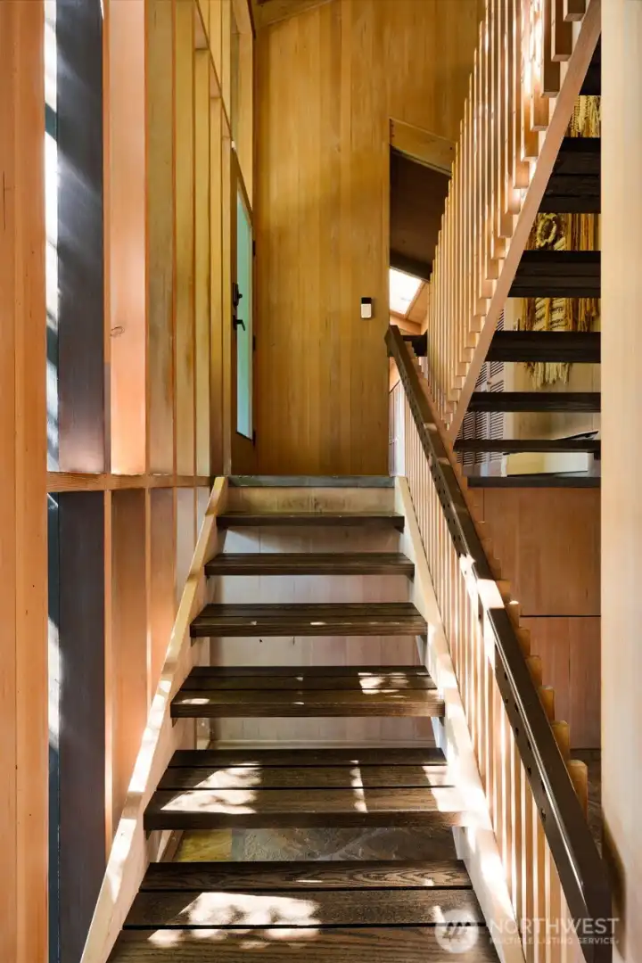Stairs down to the lower family room. Stairs down to the lower family room.