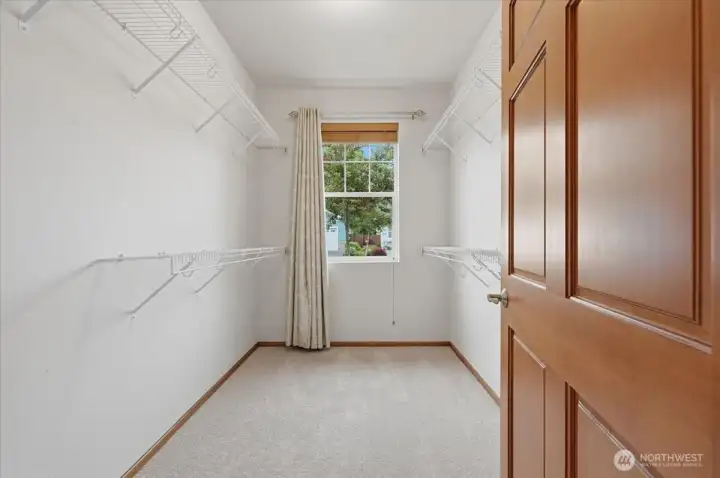 Primary suite features a large walk-in closet with natural light.