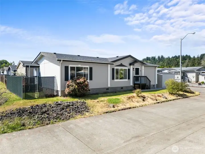 Fresh exterior paint and a brand-new roof give this corner lot home attractive curb appeal and added peace of mind. Fresh exterior paint and a brand-new roof give this corner lot home attractive curb appeal and added peace of mind.