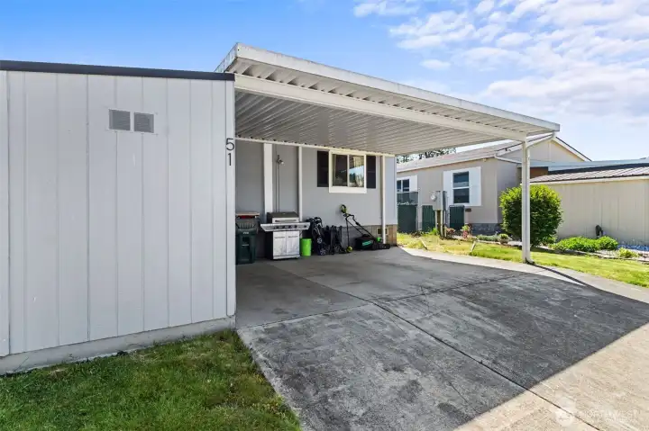 Double car carport and storage shed that also has a new roof. Double car carport and storage shed that also has a new roof.