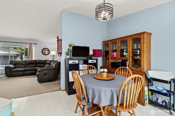 Functional dining area conveniently located off the kitchen with room for both dining furniture and storage pieces. Functional dining area conveniently located off the kitchen with room for both dining furniture and storage pieces.