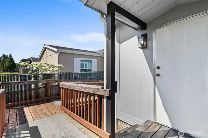 Covered porch area where the ramp accesses the back door. Covered porch area where the ramp accesses the back door.