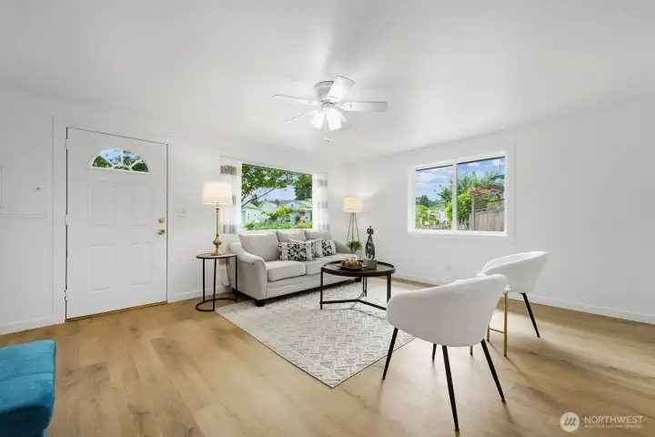 Brand new gorgeous wide plank oak flooring with new baseboard and trim give the home a polished elevated look throughout.