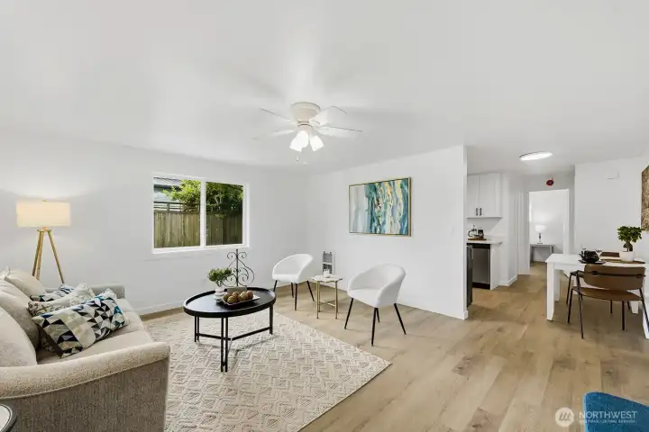 Welcome to 829 N. 1st street, the south unit. This bright living room features new picture windows looking out front to the north and to the east.