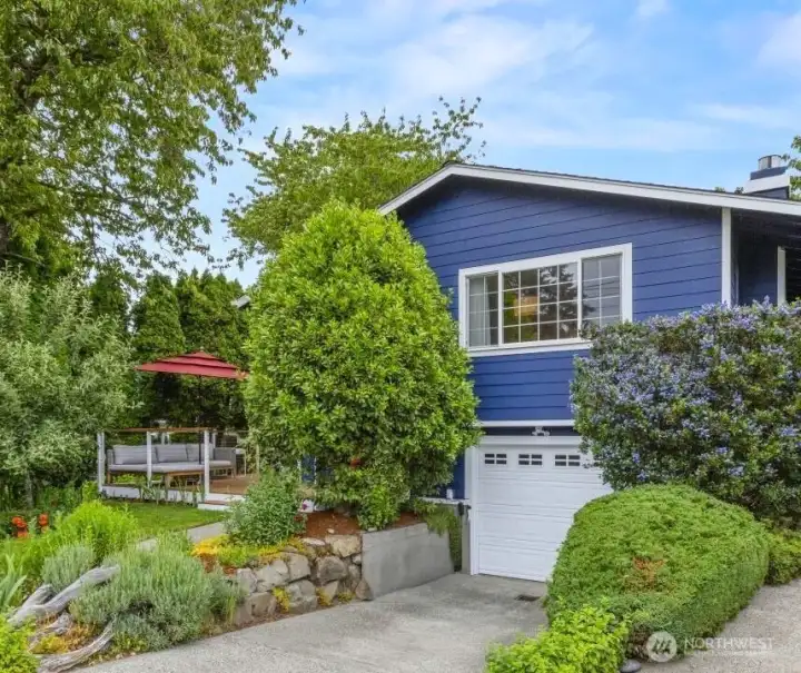Beautifully maintained home with vibrant landscaping