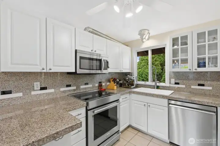 Bright kitchen with granite countertops