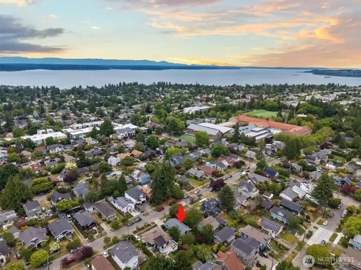 Seattle skyline, water, and mountain views beyond.