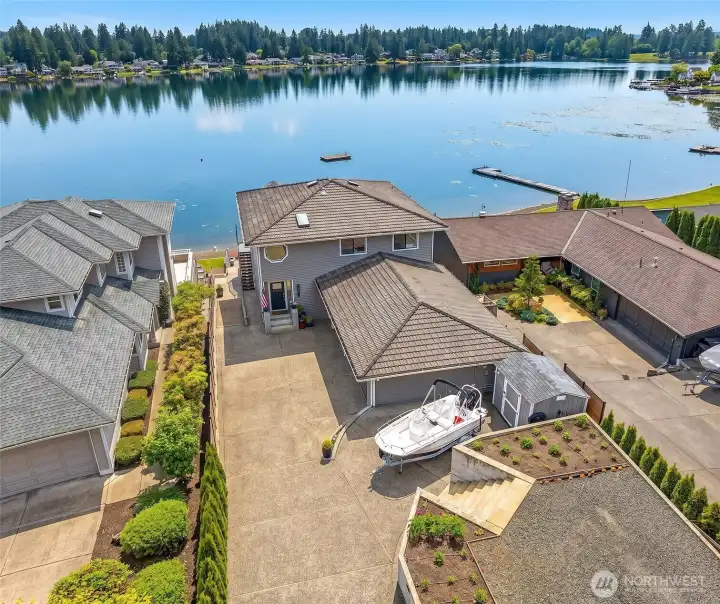 Aerial view of front, w/parking pad and long driveway & lake access. Aerial view of front, w/parking pad and long driveway & lake access.