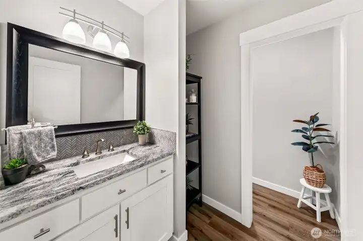 Cute 1/2 bath on main. Cute 1/2 bath on main.