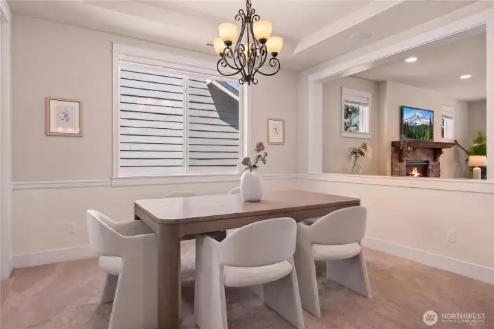 Formal dining room with more fine finish work and recessed ceiling.