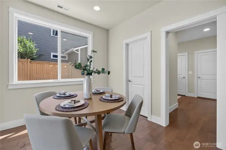 Angle looking towards the walk-in pantry and mud room with a closet and a door leading out to the garage.