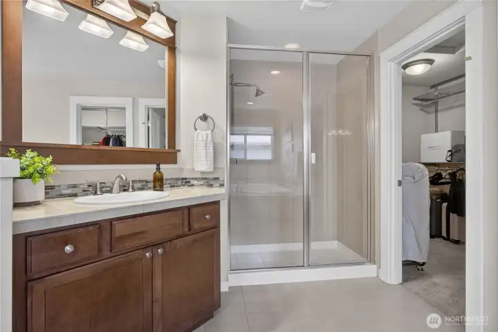 Second sink, tile floors, shower and walk-in closet.