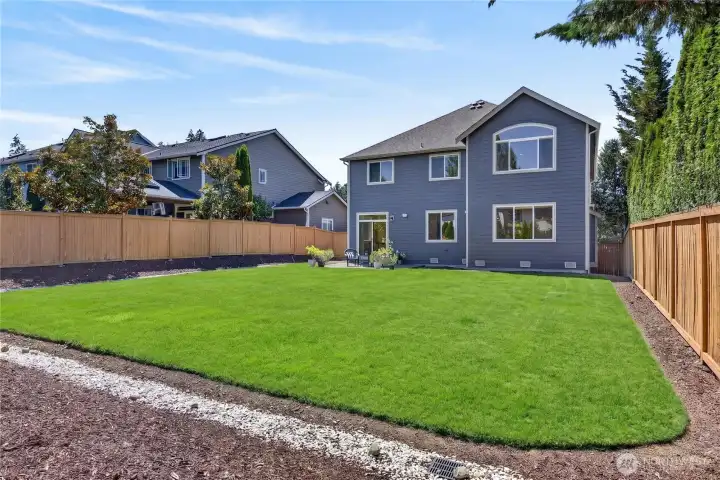Spacious Patio for Outdoor Dining & Entertaining with a Sprinkler System. Side yard with central air conditioning and convenient gas stand-by generator.