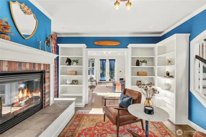 Sitting Room with wood burning fireplace & built-in bookcases