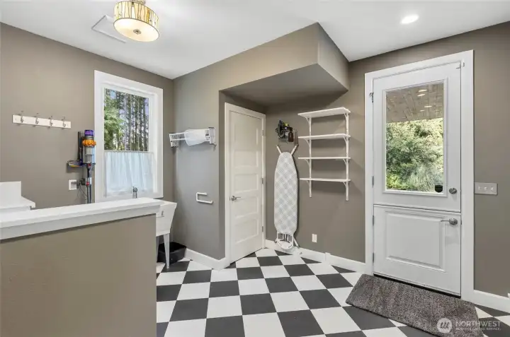 Laundry / Mudroom - Dutch door leads out to the attached carport - EV charger.