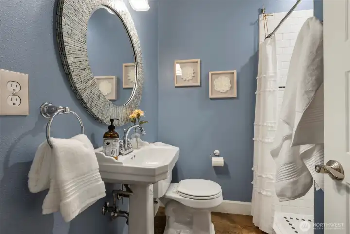 Bath with shower on the main floor.