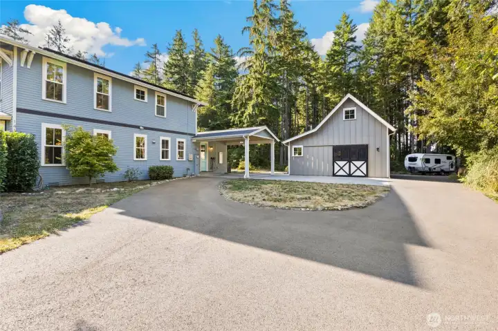 attached carport gets you into the house with ease! Additional Parking behind the Barn/Shop is ideal for RV, Boat - or both!