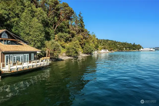 AND NOW, the beach house with three beds, two baths, 1226 square feet, spacious decks and wondrous views of the Sound and Mt. Rainier. Enjoy the feeling of being perched just above the water.