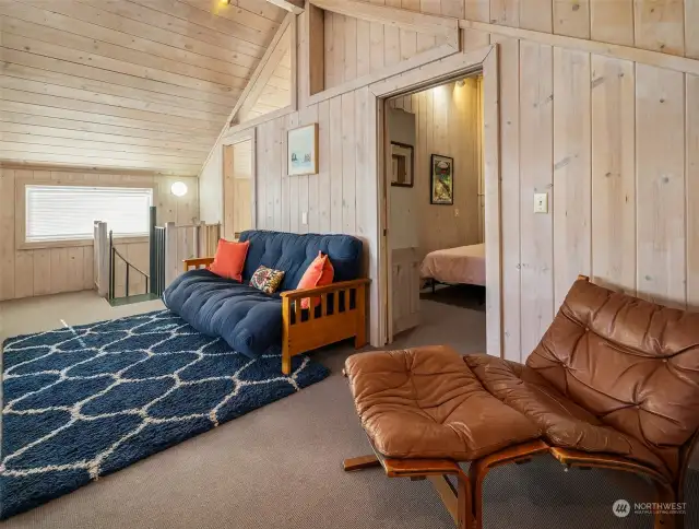 Hang-out space at the top of the spiral stairs. White-washed walls, vaulted ceilings and custom touches.