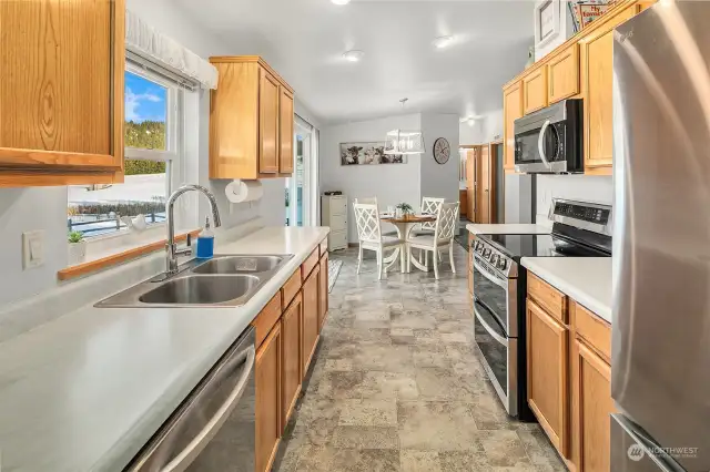 Nicely appointed kitchen and dining area. Brand new stainless steel appliances included!