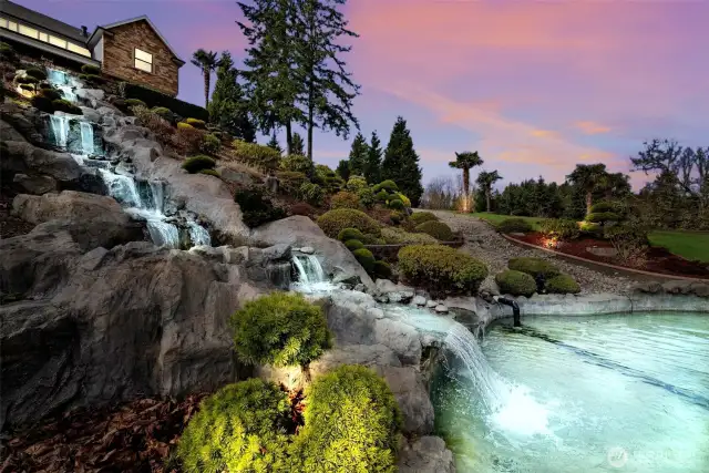 Incredible opportunity to own a sophisticated luxury living w/ 4 BDs + bonus rms, Media room, a large office, 4.5 bathroom & 3-car garage on shy 2 Acres. Soaring ceilings, walls of windows, dual grand staircase, quintessential floor plan, the perfect fit for the demands of an affluent lifestyle. picturesque, picturesque and panoramic Mt. Rainier views. Enchanting outdoors welcomes you with two water features (impressive large, covered porches, outdoor fireplace, outdoor kitchen, surrounded in privacy with Mt. Rainier and territorial views. The premiere gated neighborhood in the heart of lacey. Resort living at its best!
