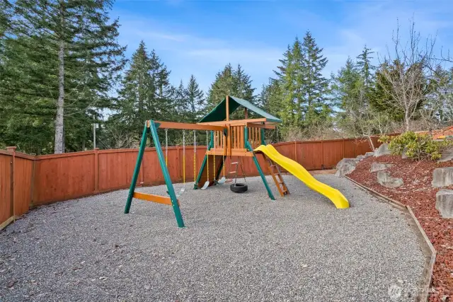 The backyard features a delightful outdoor play area designed with children in mind. From swings and slides to climbing structures, it offers endless opportunities for adventure and imagination. Surrounded by lush landscaping and safely enclosed, this charming space allows little ones to play freely while parents relax nearby. It’s the perfect spot for family fun, sunny afternoons, and making lasting childhood memories.