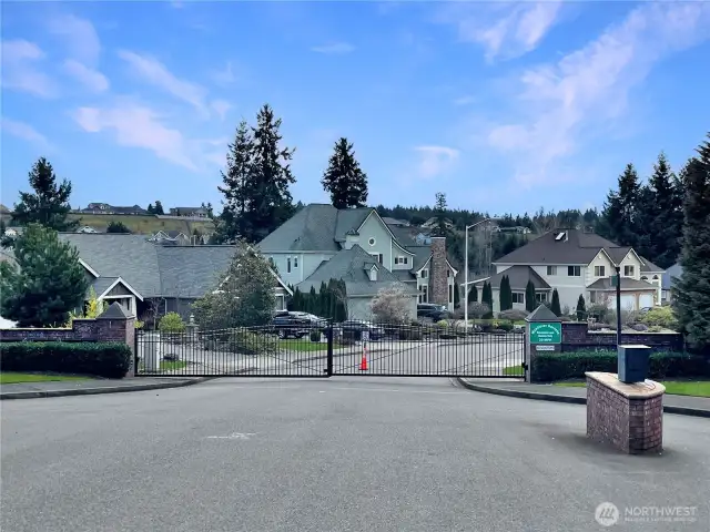 Unmatched value awaits! You can always change the home, but you CANNOT change the location. The moment you enter this prestigious gated community, you'll instantly fall in love with this private community and one-of-a-kind custom home perched atop the hill, offering breathtaking views and unparalleled privacy.