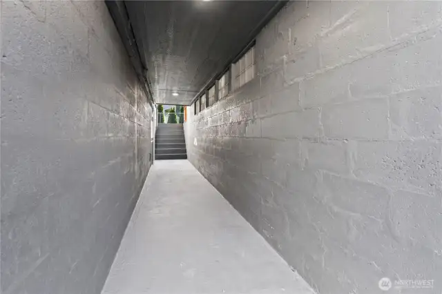 B/Lower Floor: Breezeway with Stairs at one end that lead to the Front Parking and Stairs to the Backyard.
