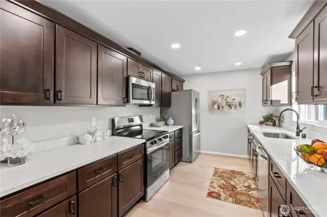 A/Main Floor: New Laminate Floors, Shiny New Stainless Steel Appliances, Recessed Lighting.