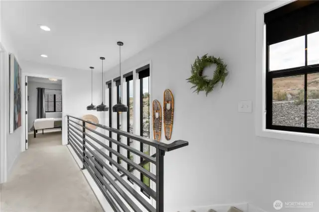 10ft tall windows in stairwell. Custom metal railing.