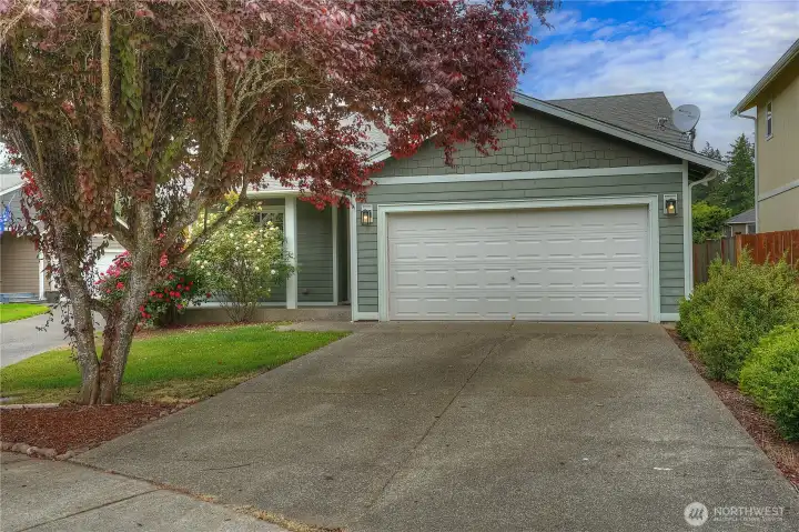 Spacious two car garage & ample driveway parking suitable for a van or your long-bed camper truck...