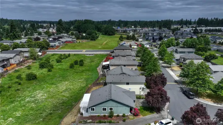 Playground with hoop court & green space is off to the right...