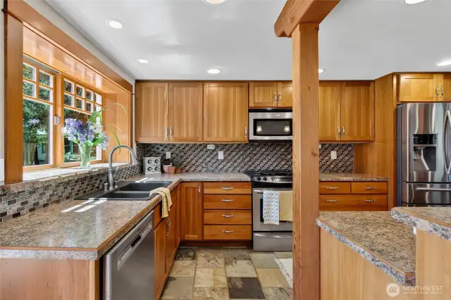 Modern stainless steel appliance, gas stove, deep 15'' cherrywood cabinets and well lite kitchen make this a contemporary kitchen welcoming you in to entertain!