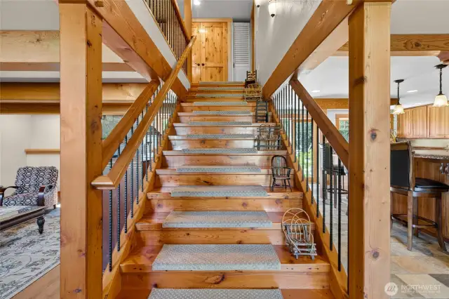Entry way stairs invite you into this home with warm wood accents.