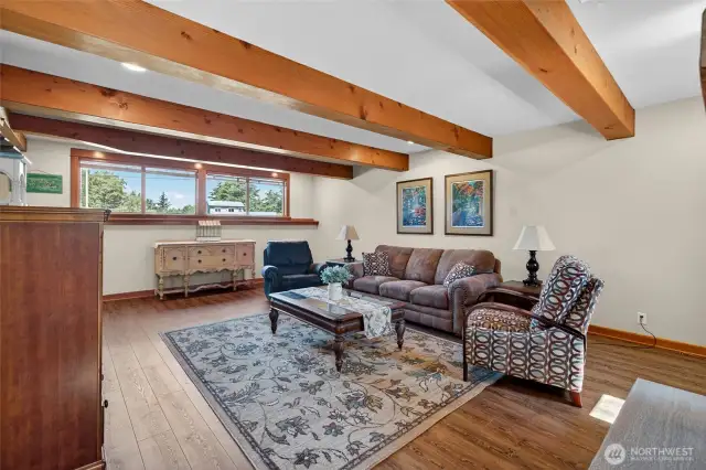 Reclaimed timber beams give this room the old world charm.