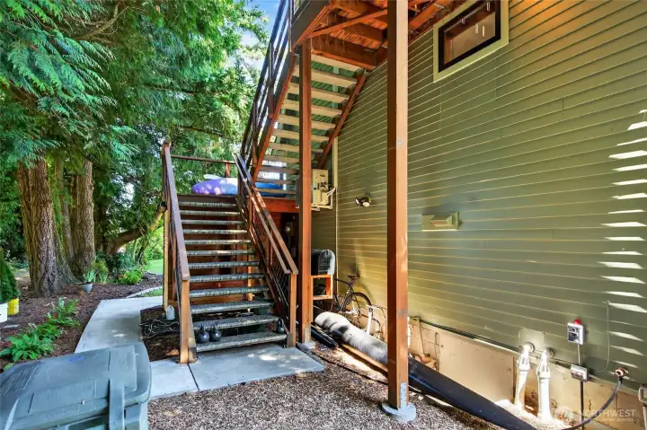 Private side entrance for ADU.  Rents for 1,400 per month. Storage for bikes and water toys under stairs.